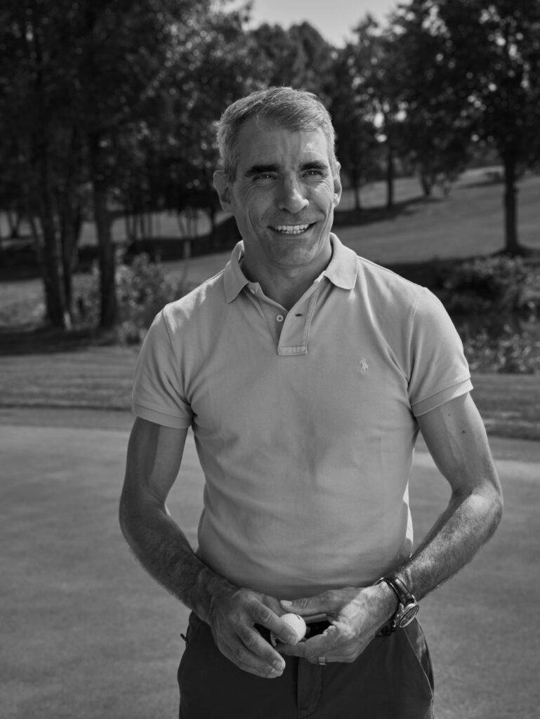 Marcel Lendenmann smiling, standing on the green