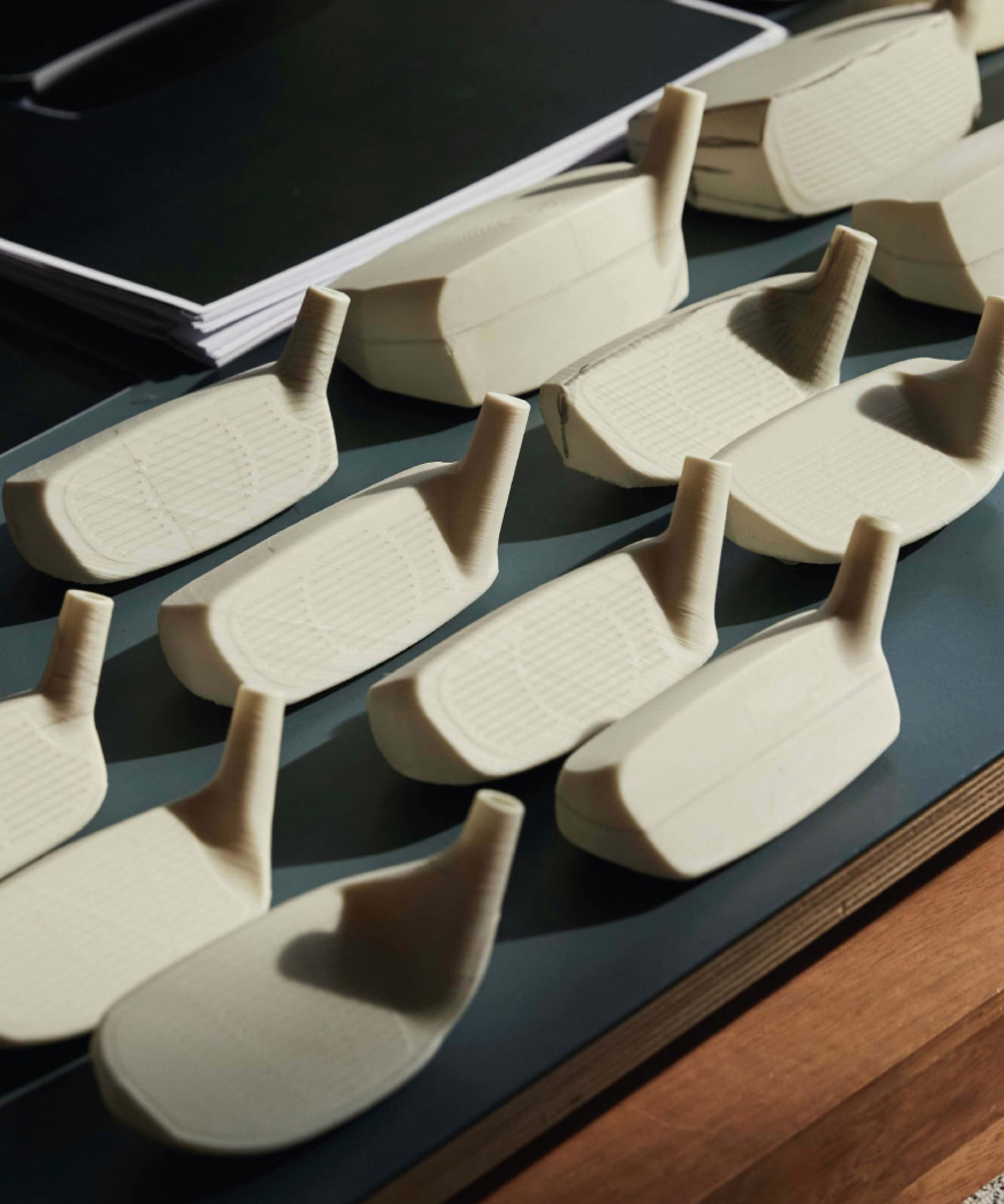 Lots of different club prototypes on a desk
