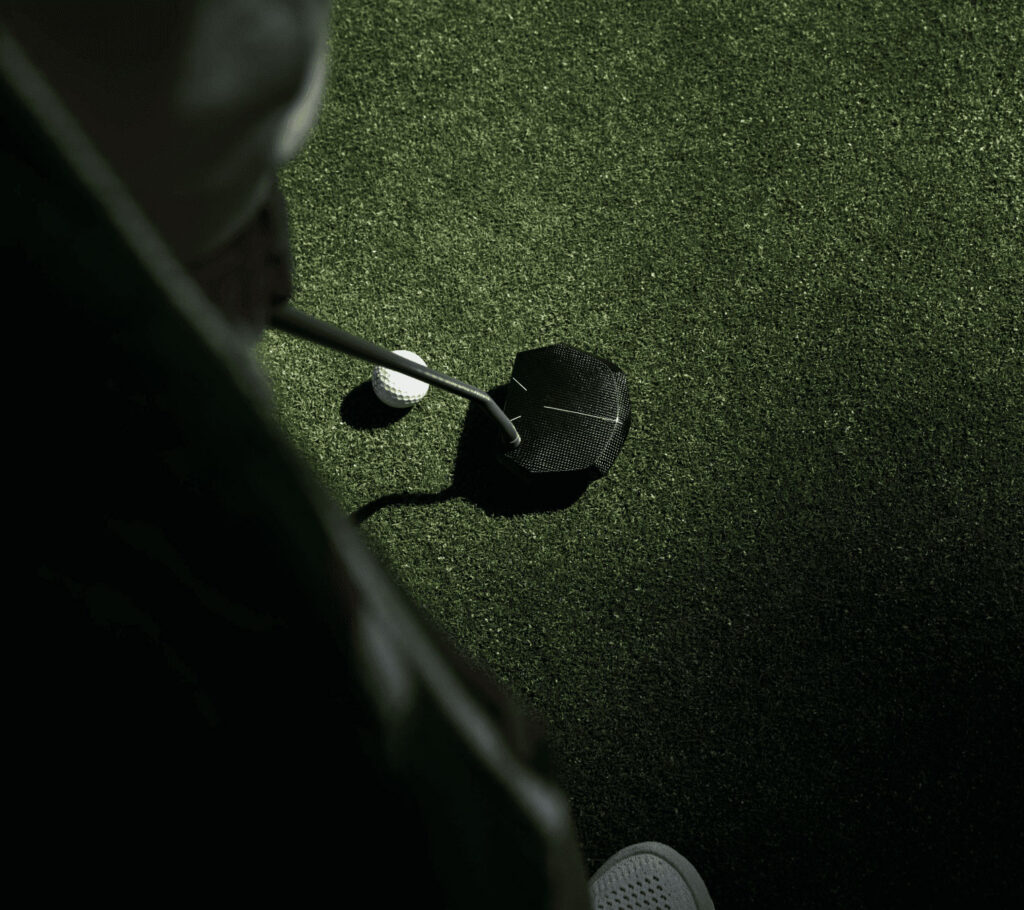 An over-the-shoulder view of The Maker, resting right in front of a golf ball